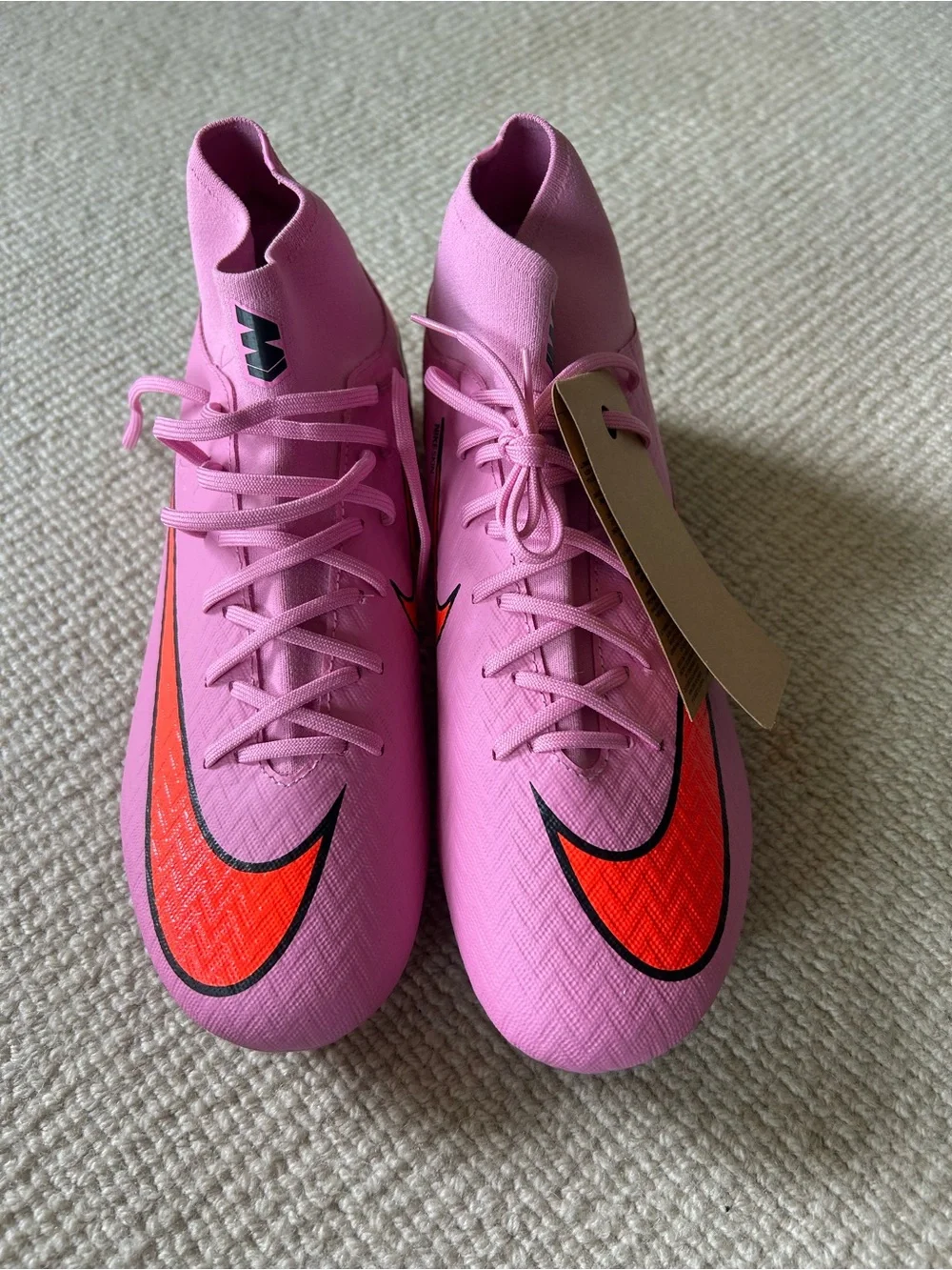 Nike Women’s Pink Sneakers with Orange Swoosh